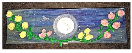 Finished Full Flower Moon altar box with pink and yellow coffee filter roses, green vines, and a glowing moon on a blue-stained wooden box